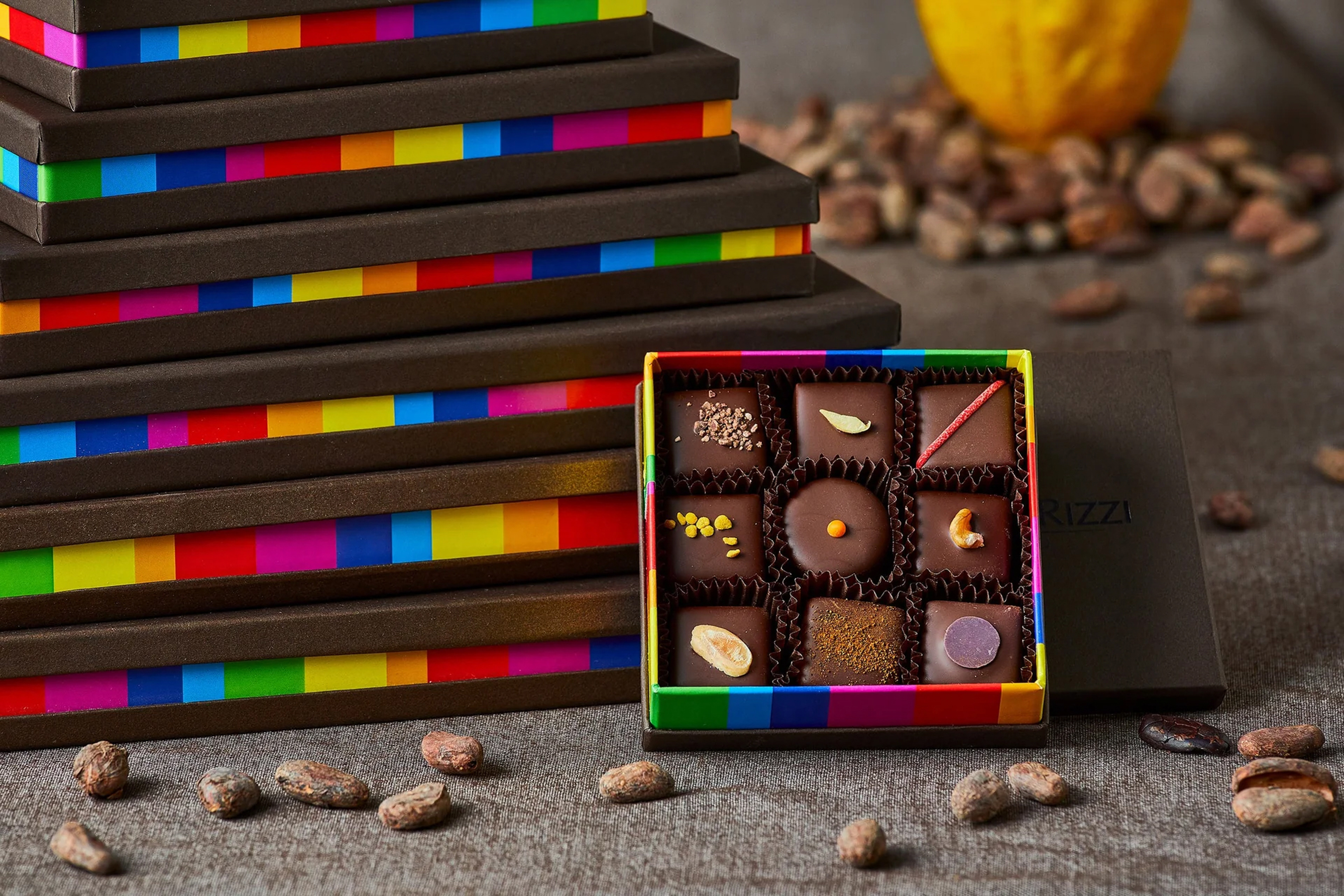 a box of chocolates next to a stack of boxes