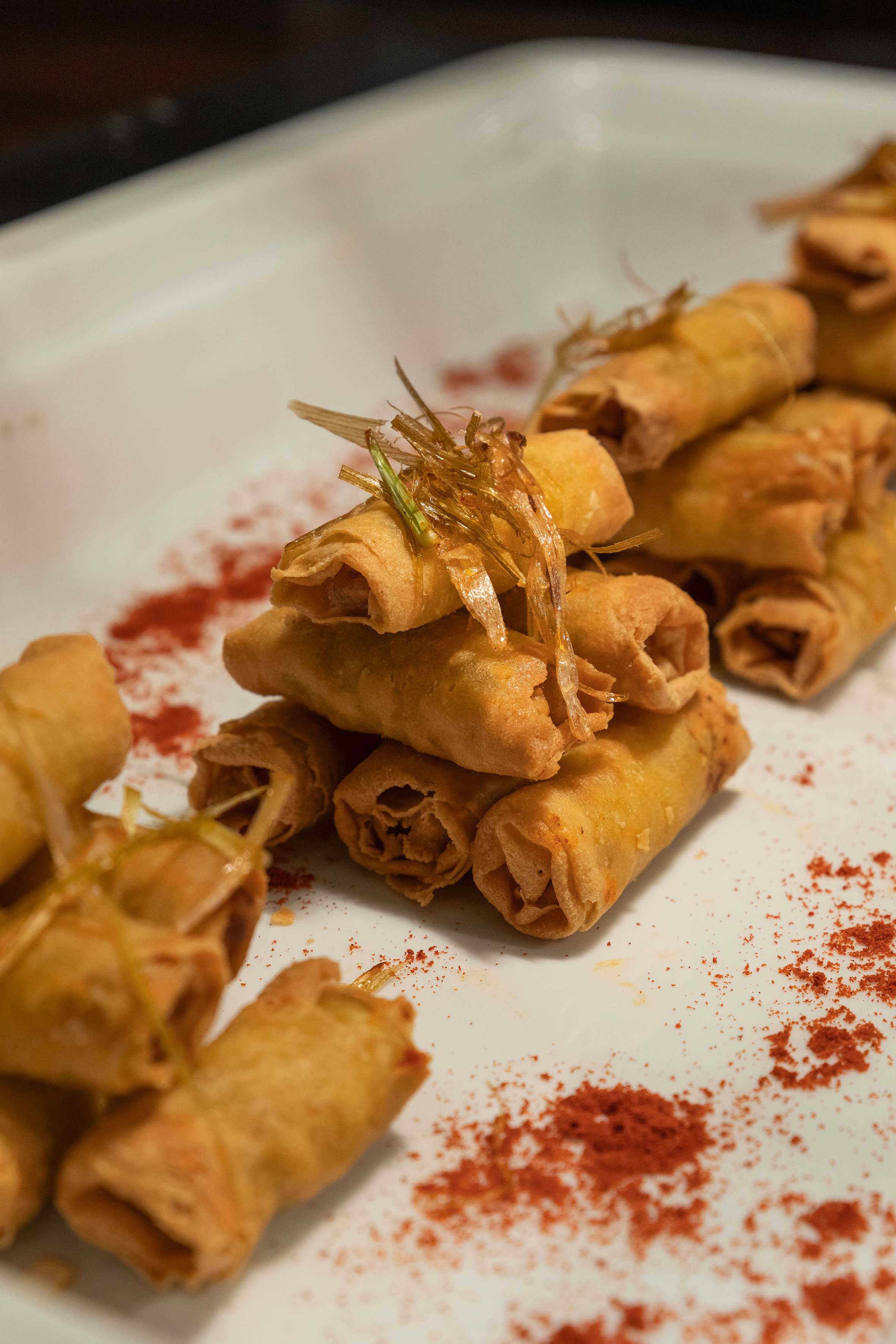 a plate of fried spring rolls