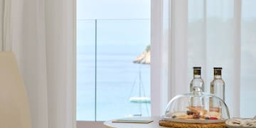 a table with a glass dome and food on it