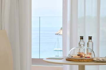 a table with a glass dome and food on it