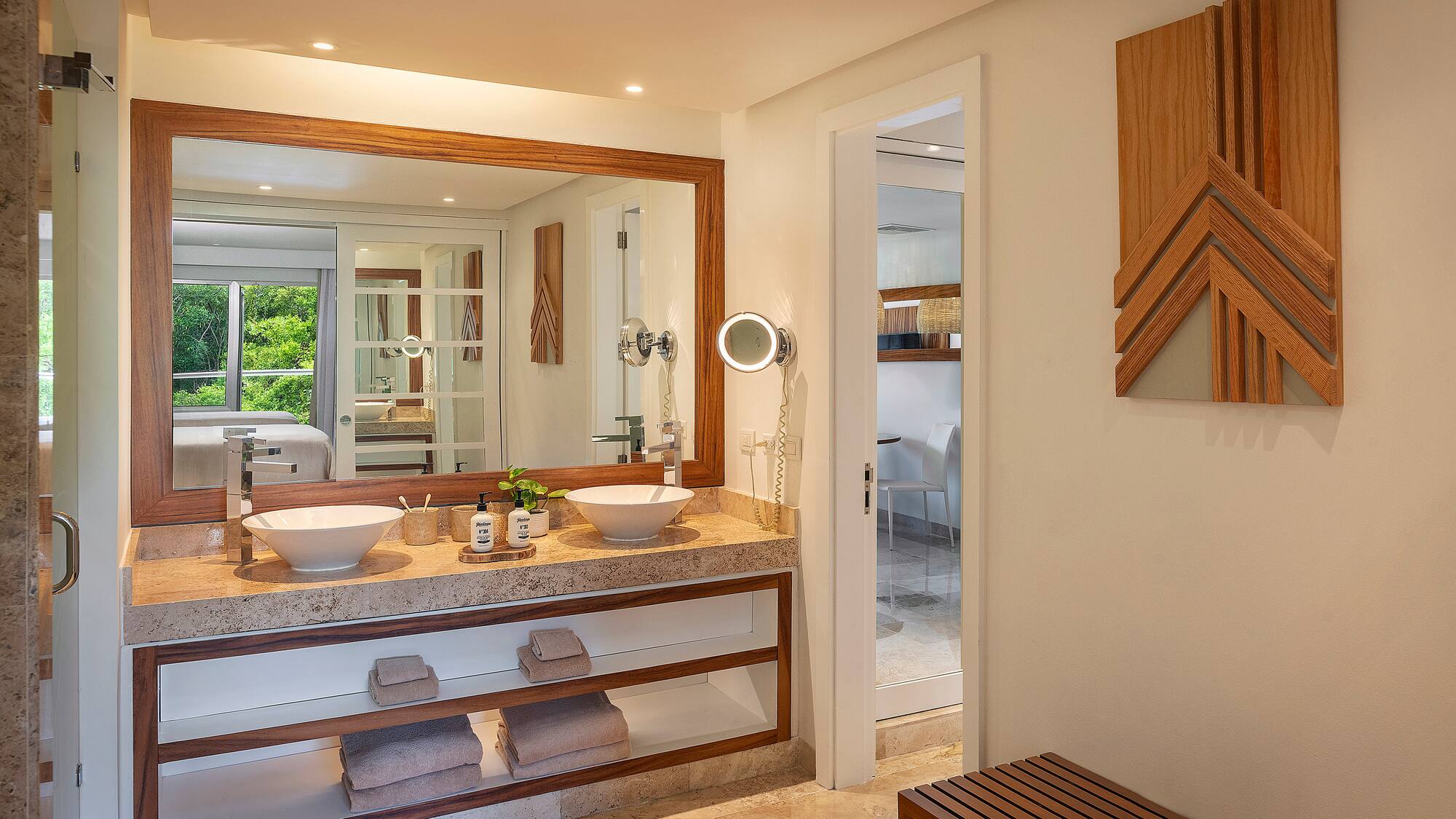 a bathroom with a large mirror and sinks