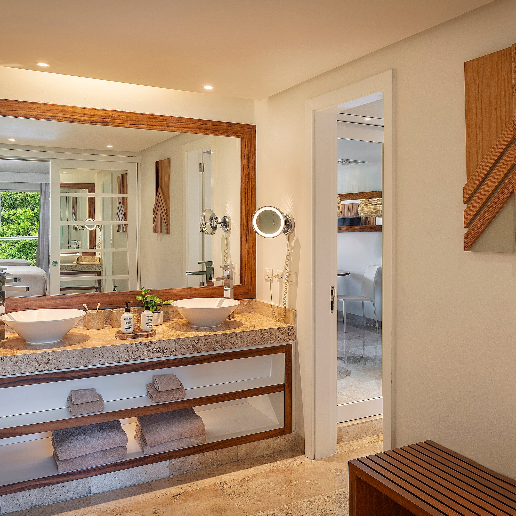 a bathroom with a large mirror and sinks
