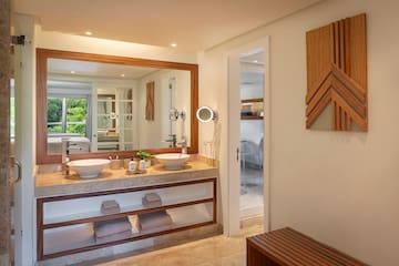 a bathroom with a large mirror and sinks