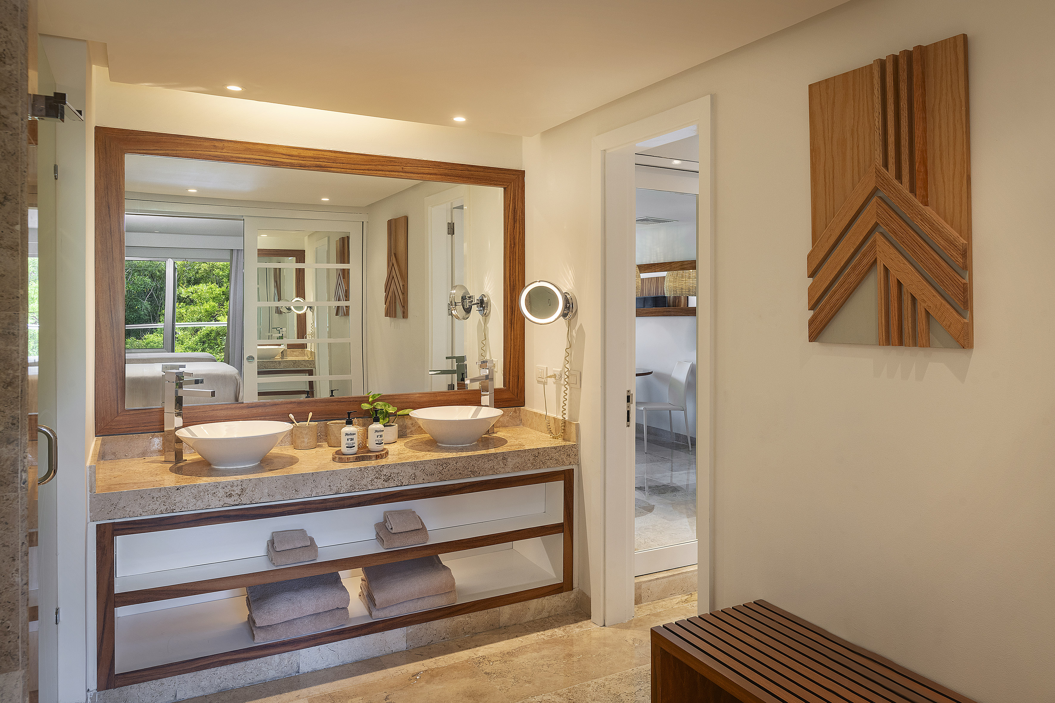 a bathroom with a large mirror and sinks