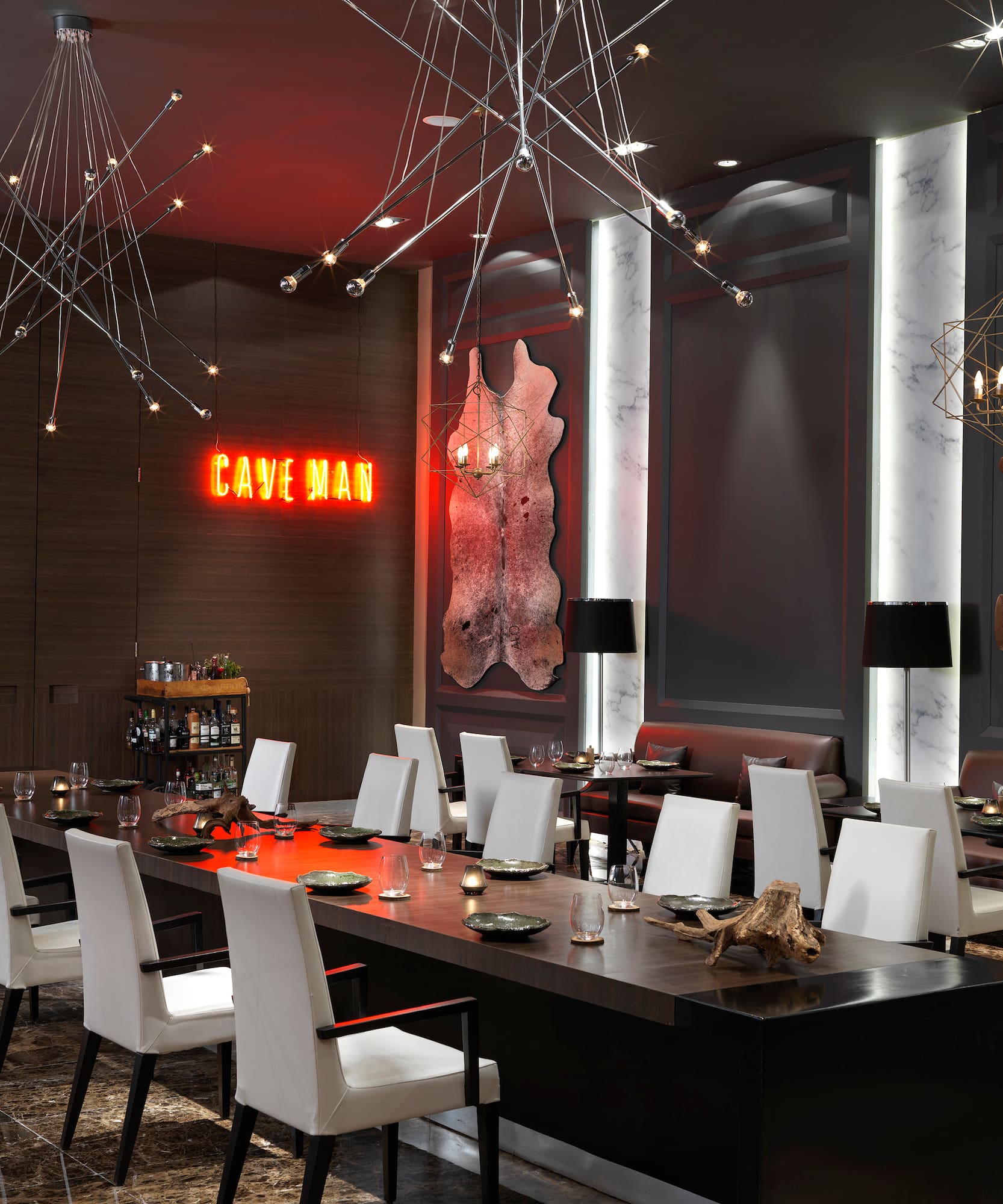 a room with a long table and chairs