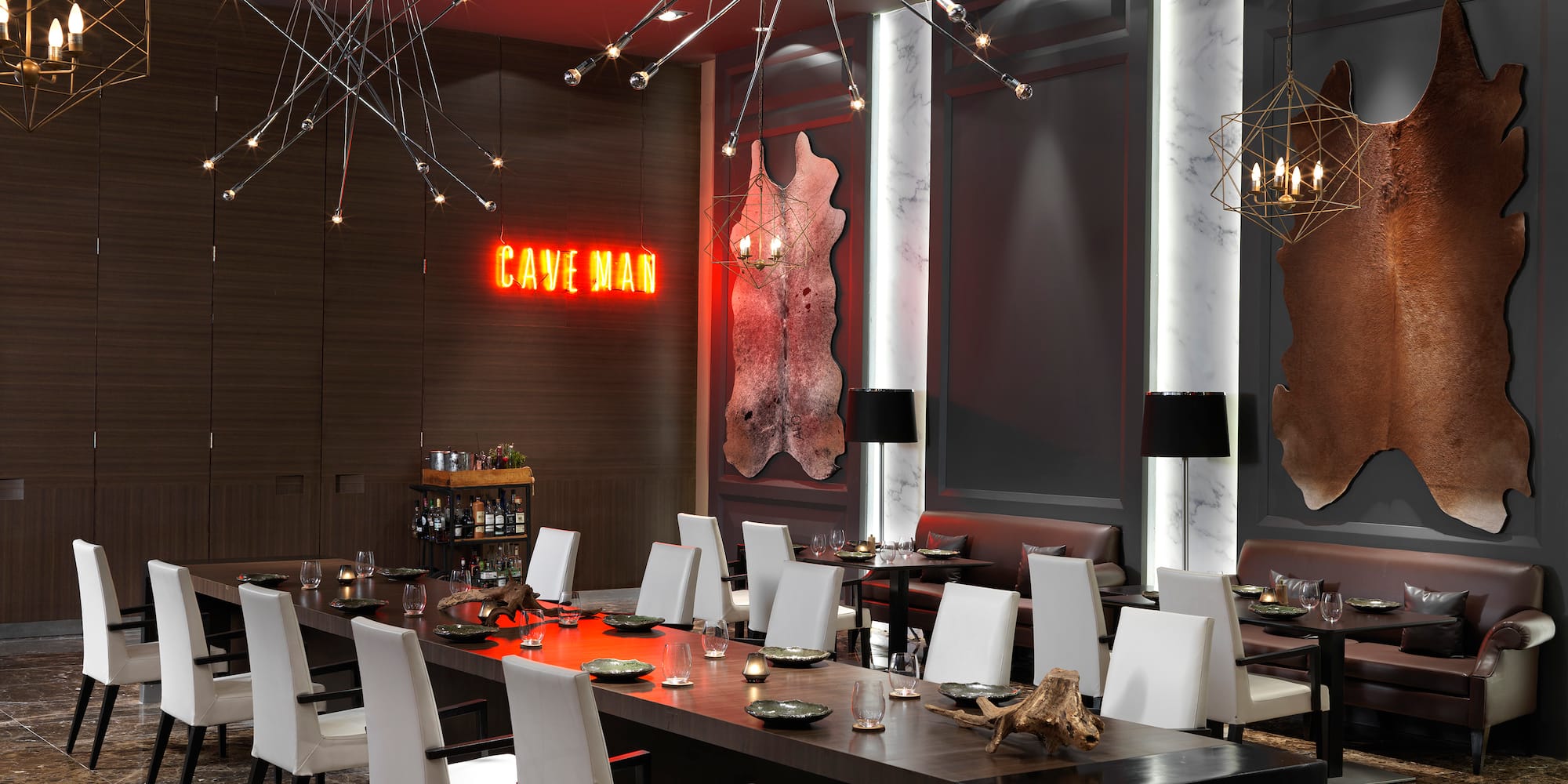 a room with a long table and chairs