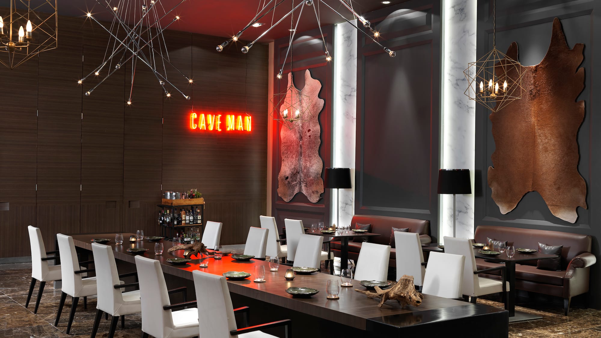 a room with a long table and chairs