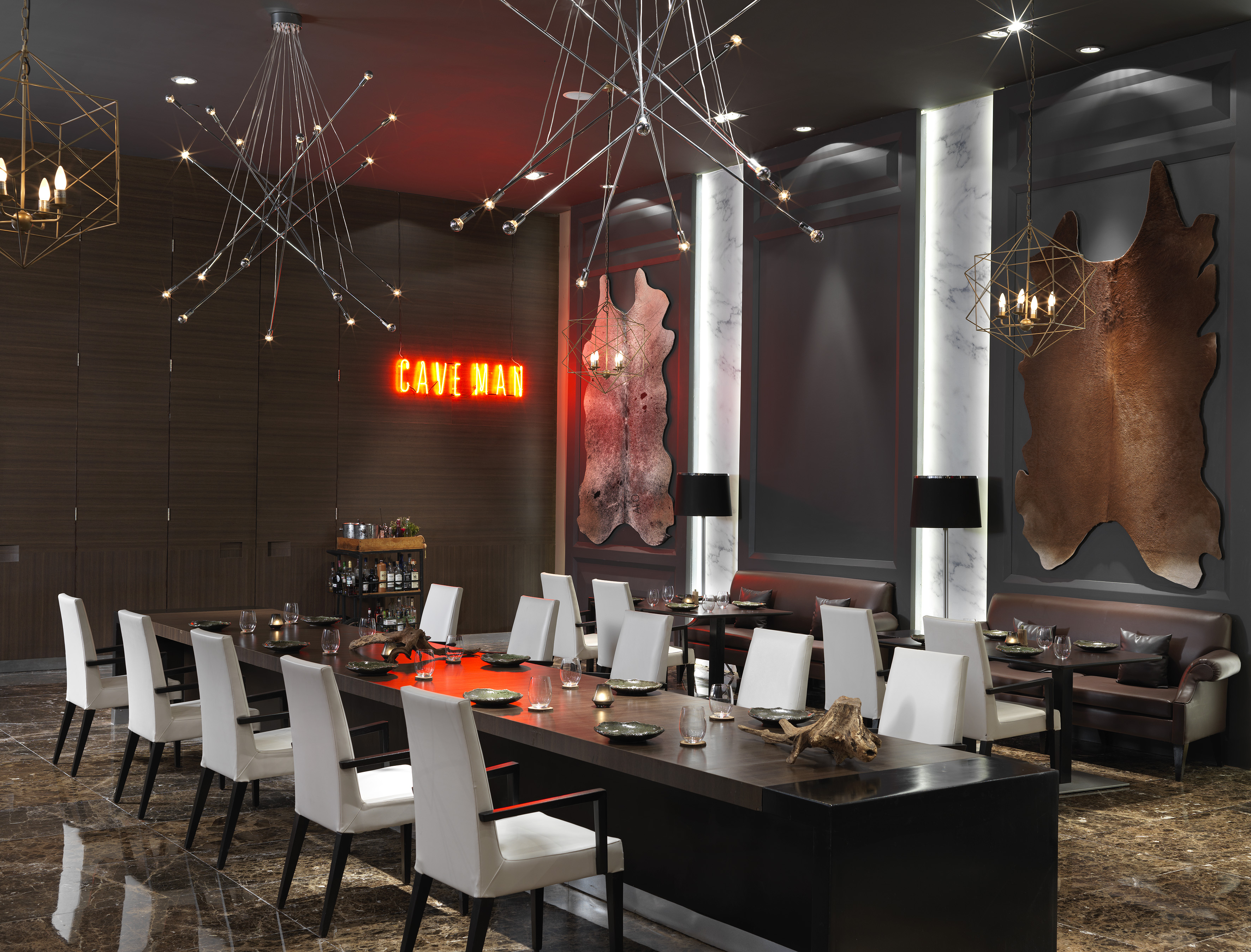 a room with a long table and chairs