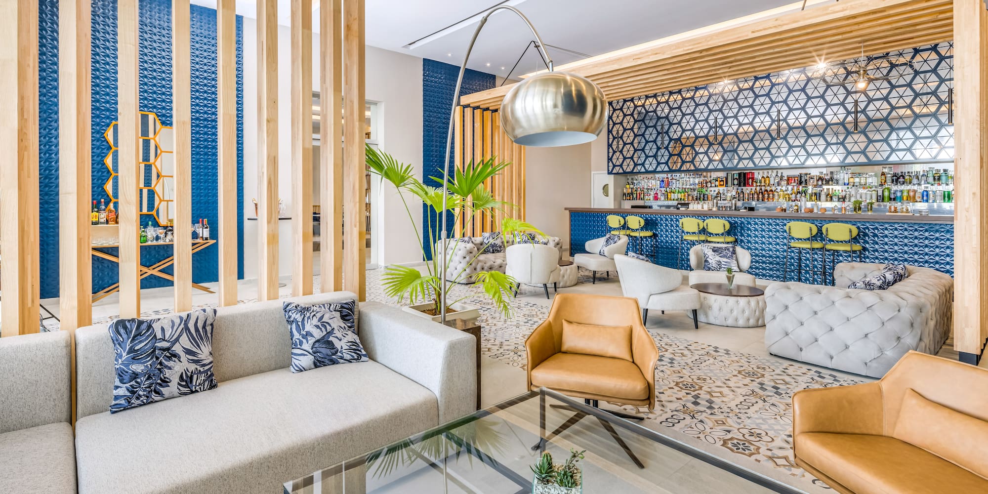 a room with a bar and lounge area