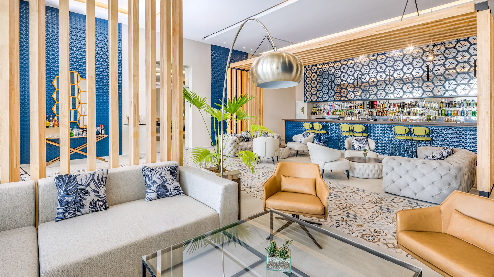 a room with a bar and lounge area