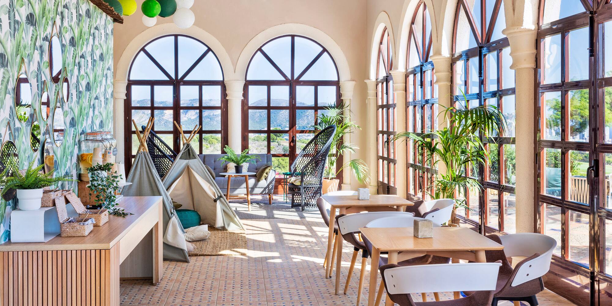 a room with tables and chairs and a tent