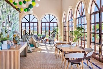a room with tables and chairs and a tent
