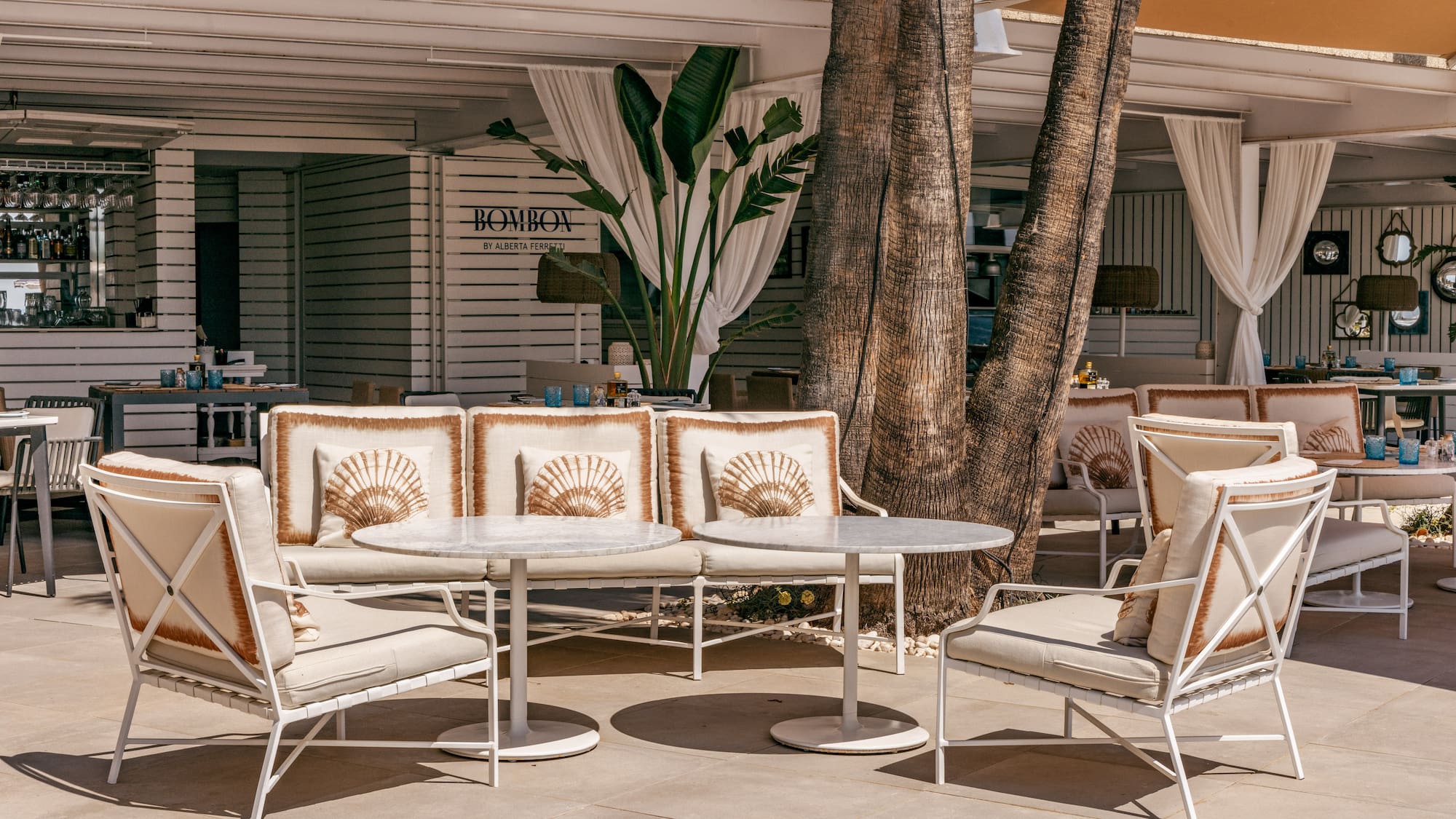 a table and chairs outside of a building