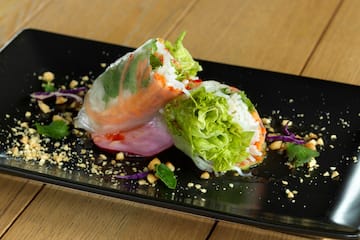 a plate of food on a wood table