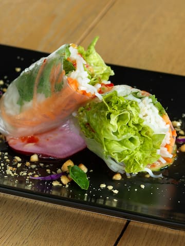 a plate of food on a wood table
