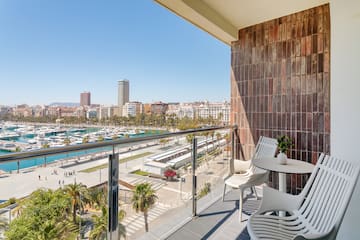 a balcony with a view of a city and boats and a city