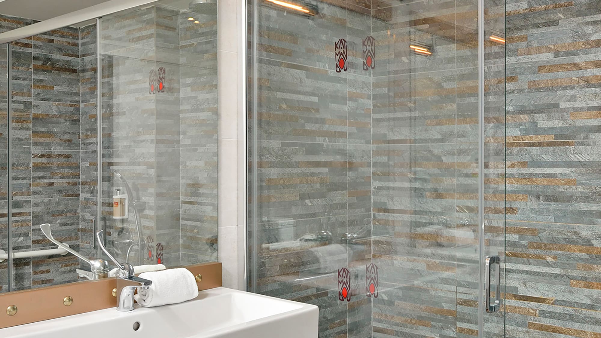 a bathroom with a sink and shower