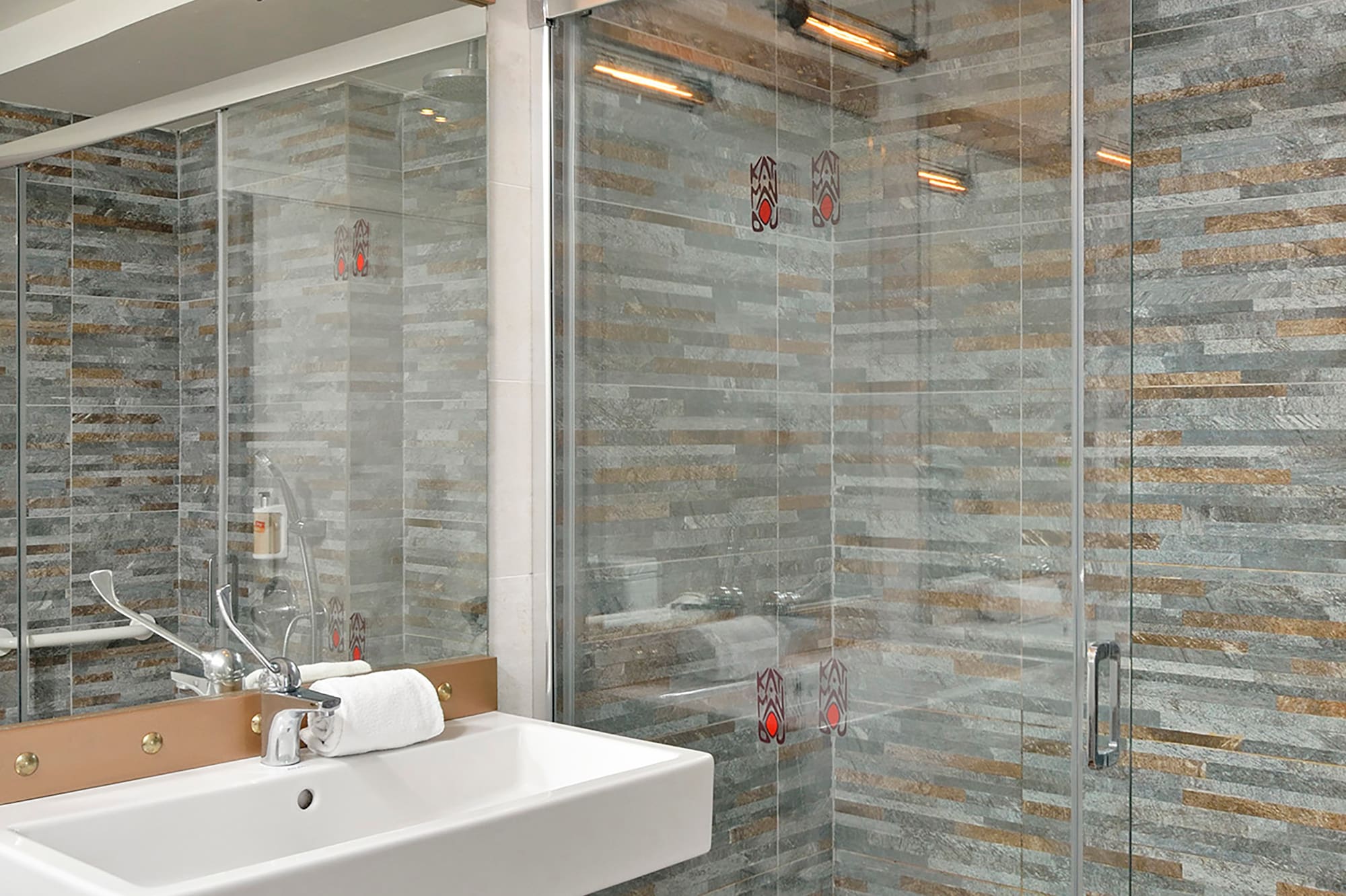 a bathroom with a sink and shower