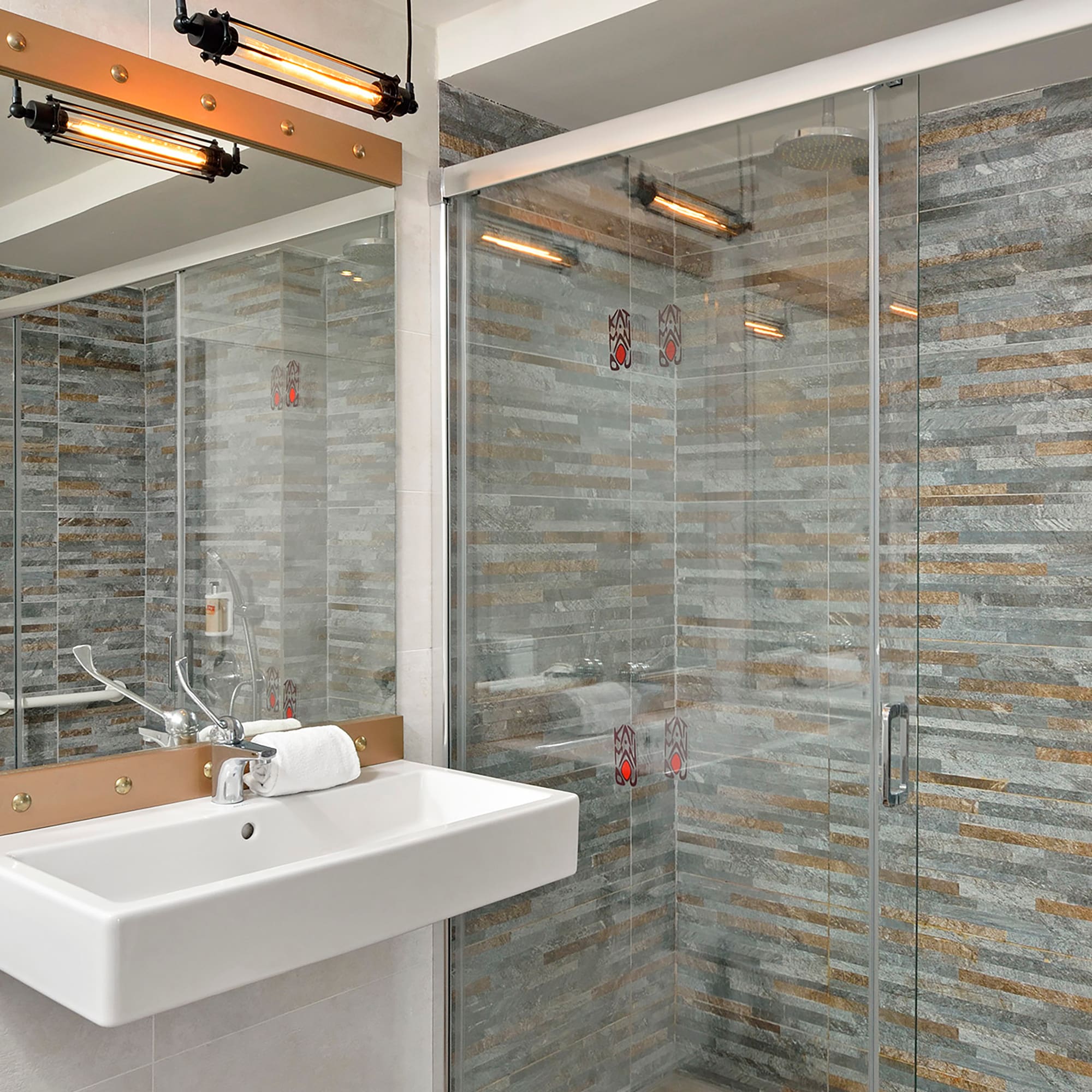 a bathroom with a sink and shower