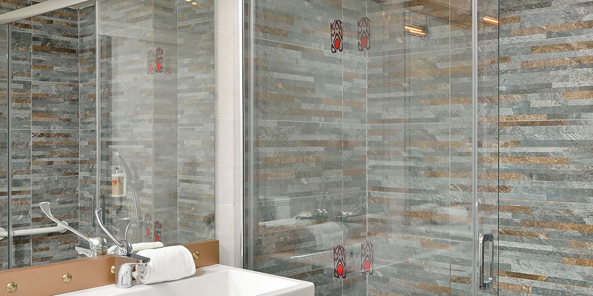 a bathroom with a sink and shower