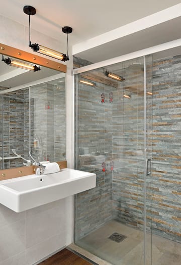 a bathroom with a sink and shower