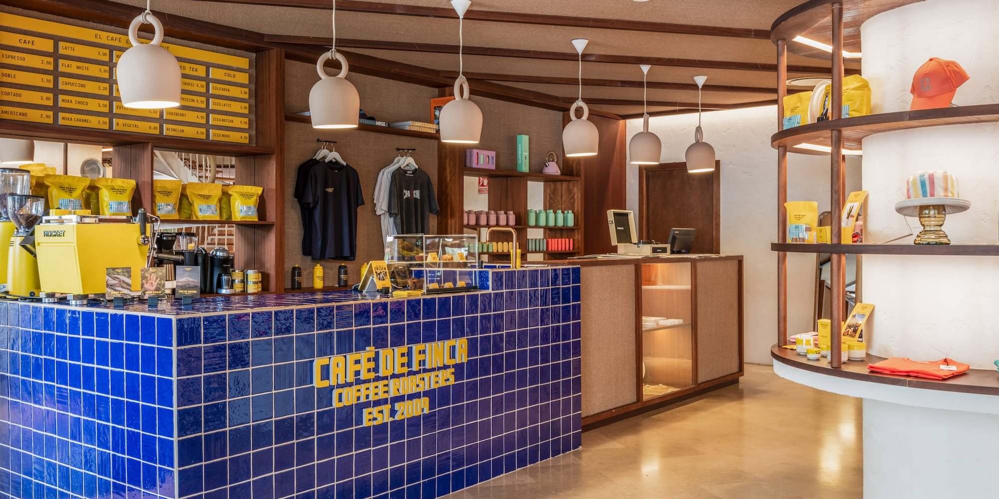 a coffee shop with blue tiles and a counter