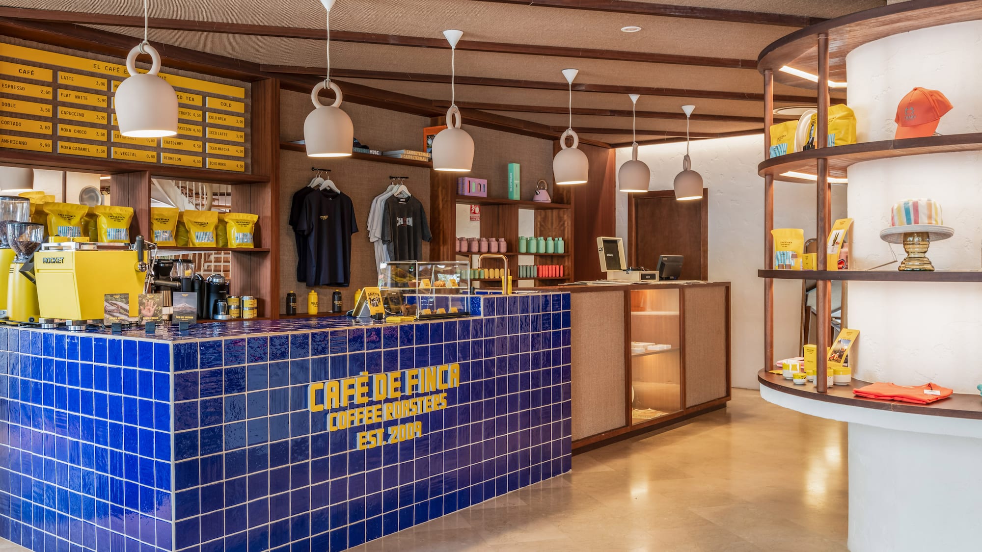a coffee shop with blue tiles and a counter