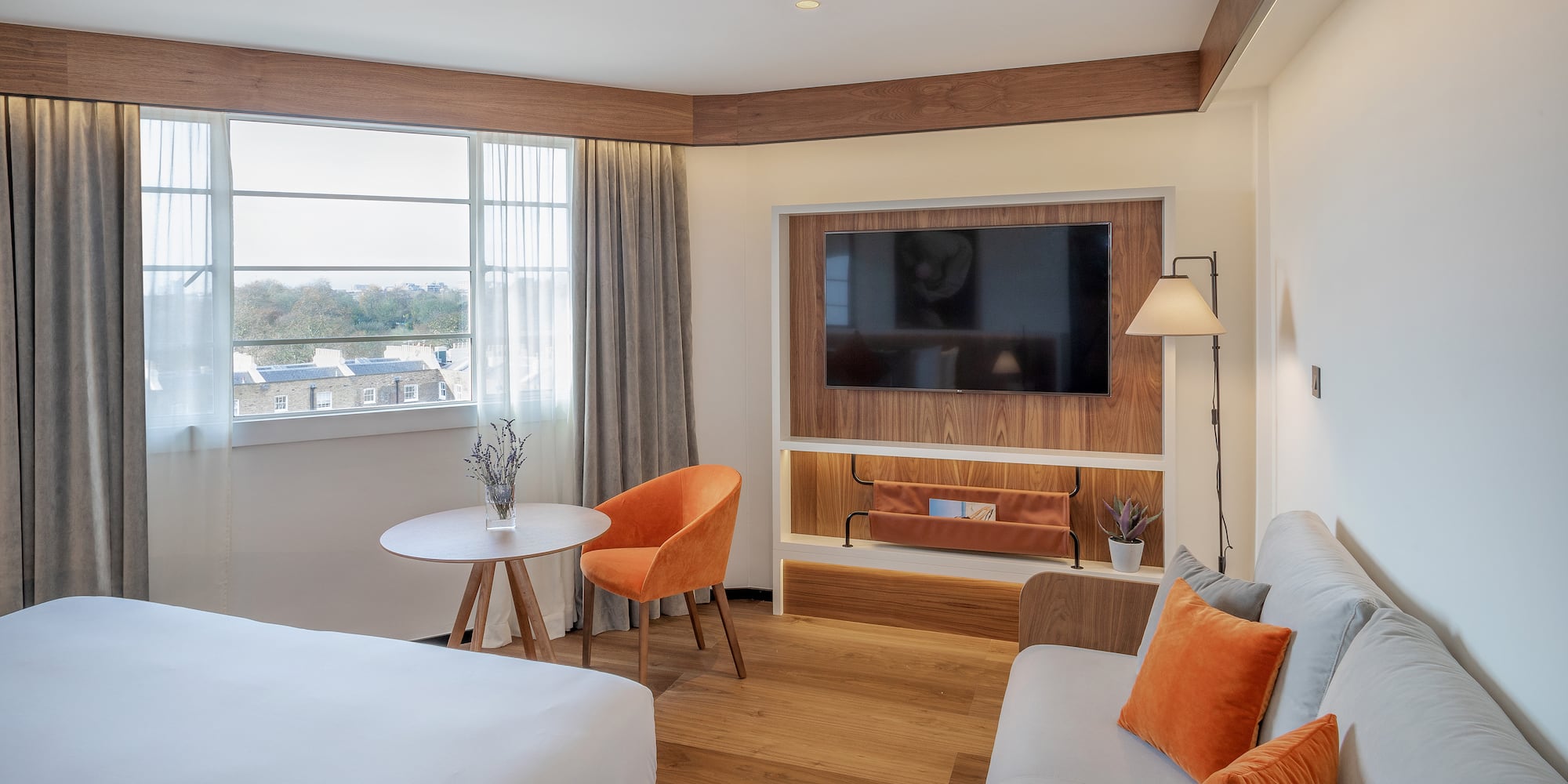 a room with a tv and couches