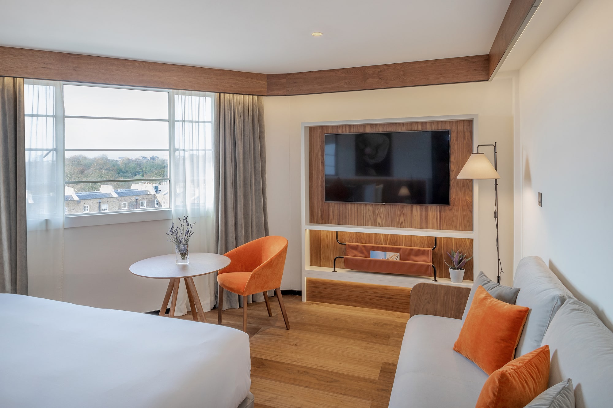 a room with a tv and couches