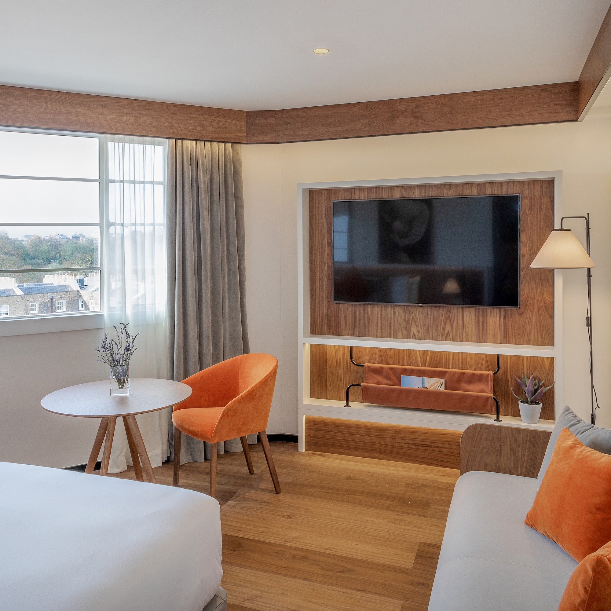 a room with a tv and couches