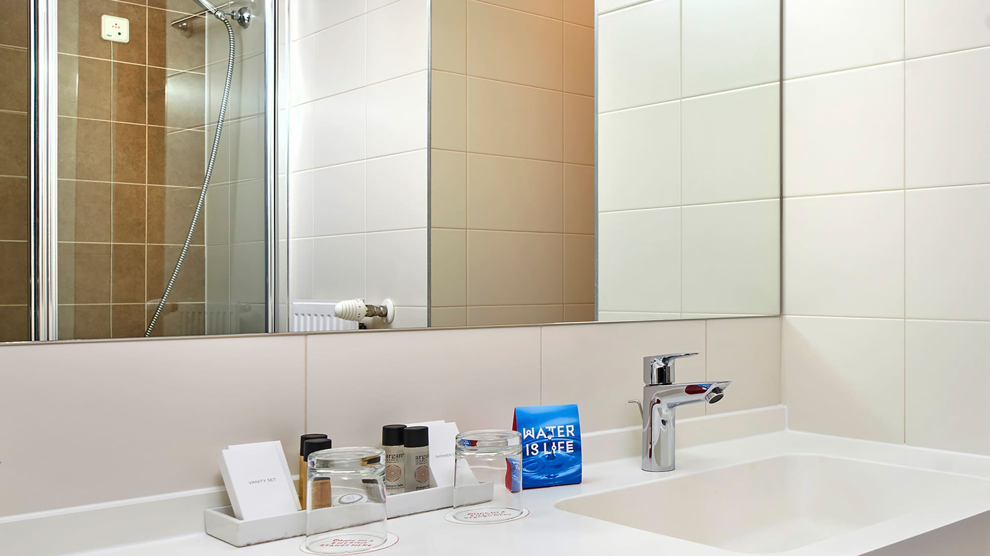 a bathroom with a mirror and sink