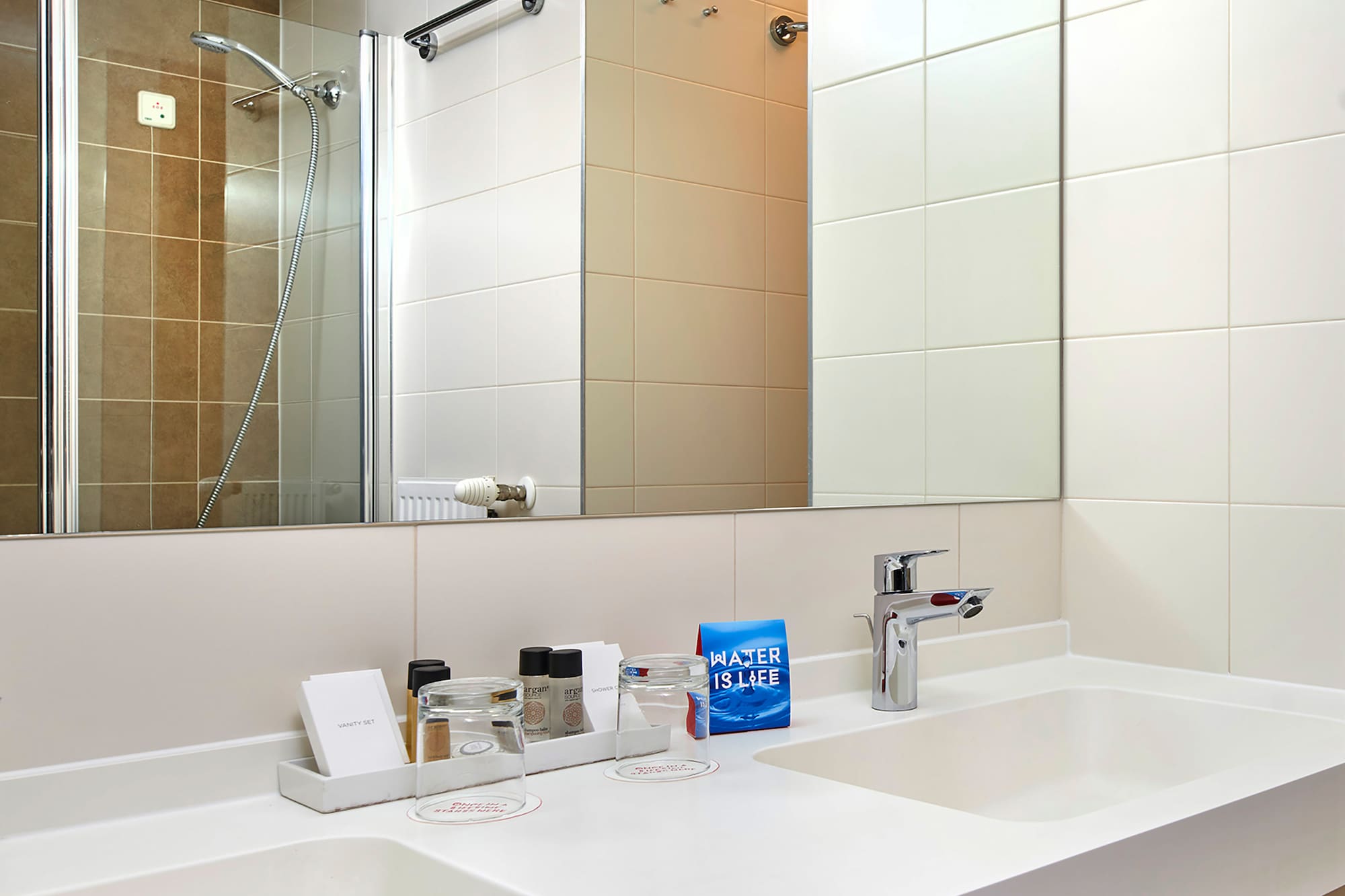 a bathroom with a mirror and sink