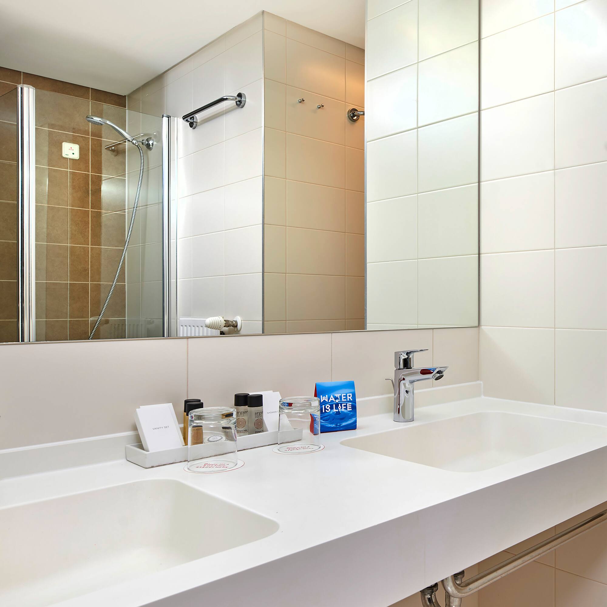 a bathroom with a mirror and sink