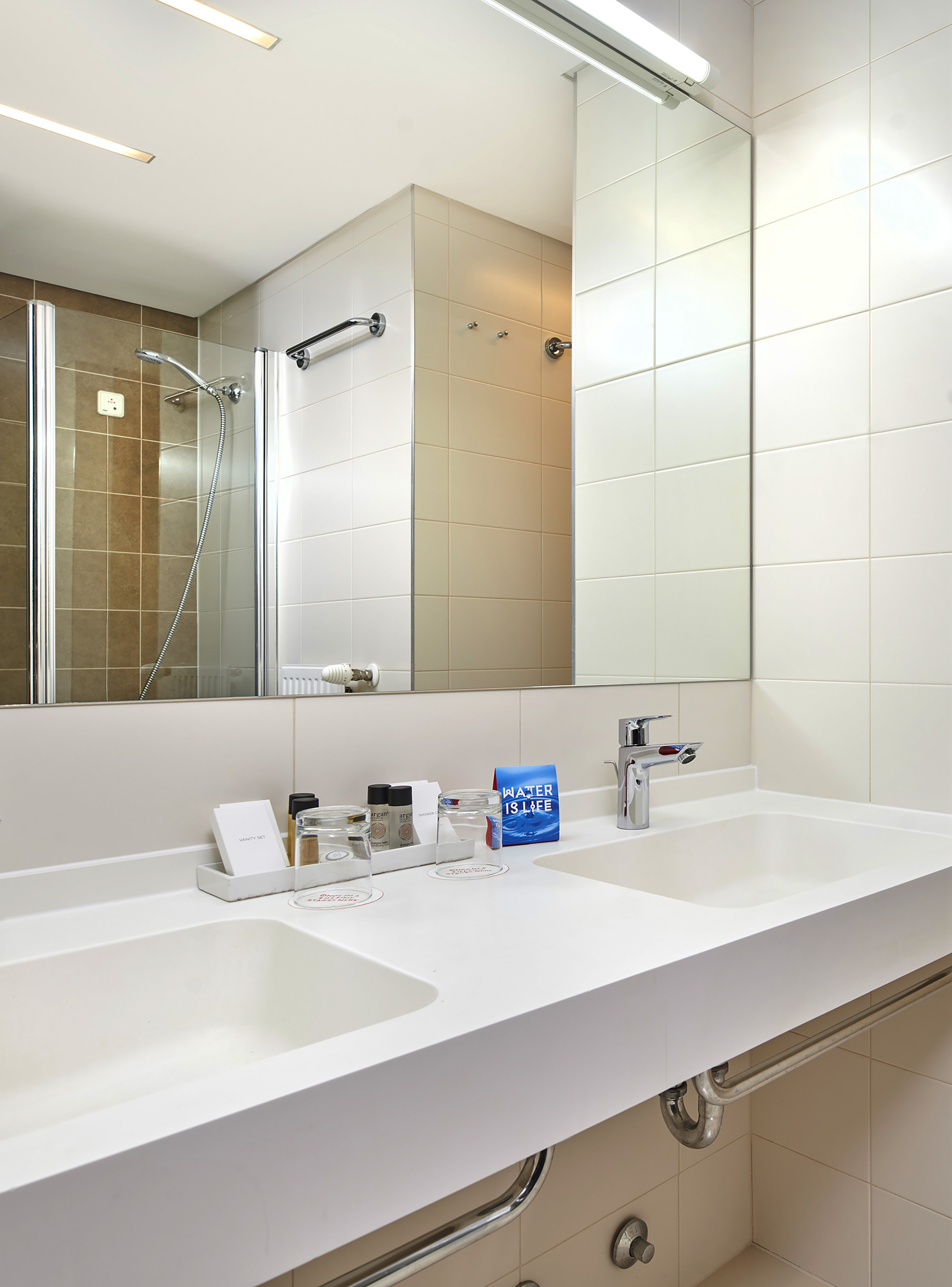 a bathroom with a mirror and sink