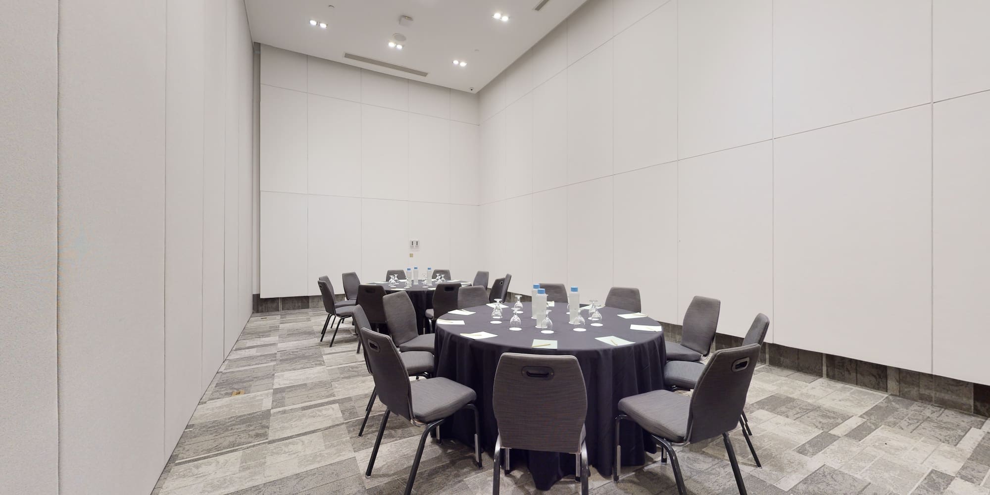 a round table with chairs in a room