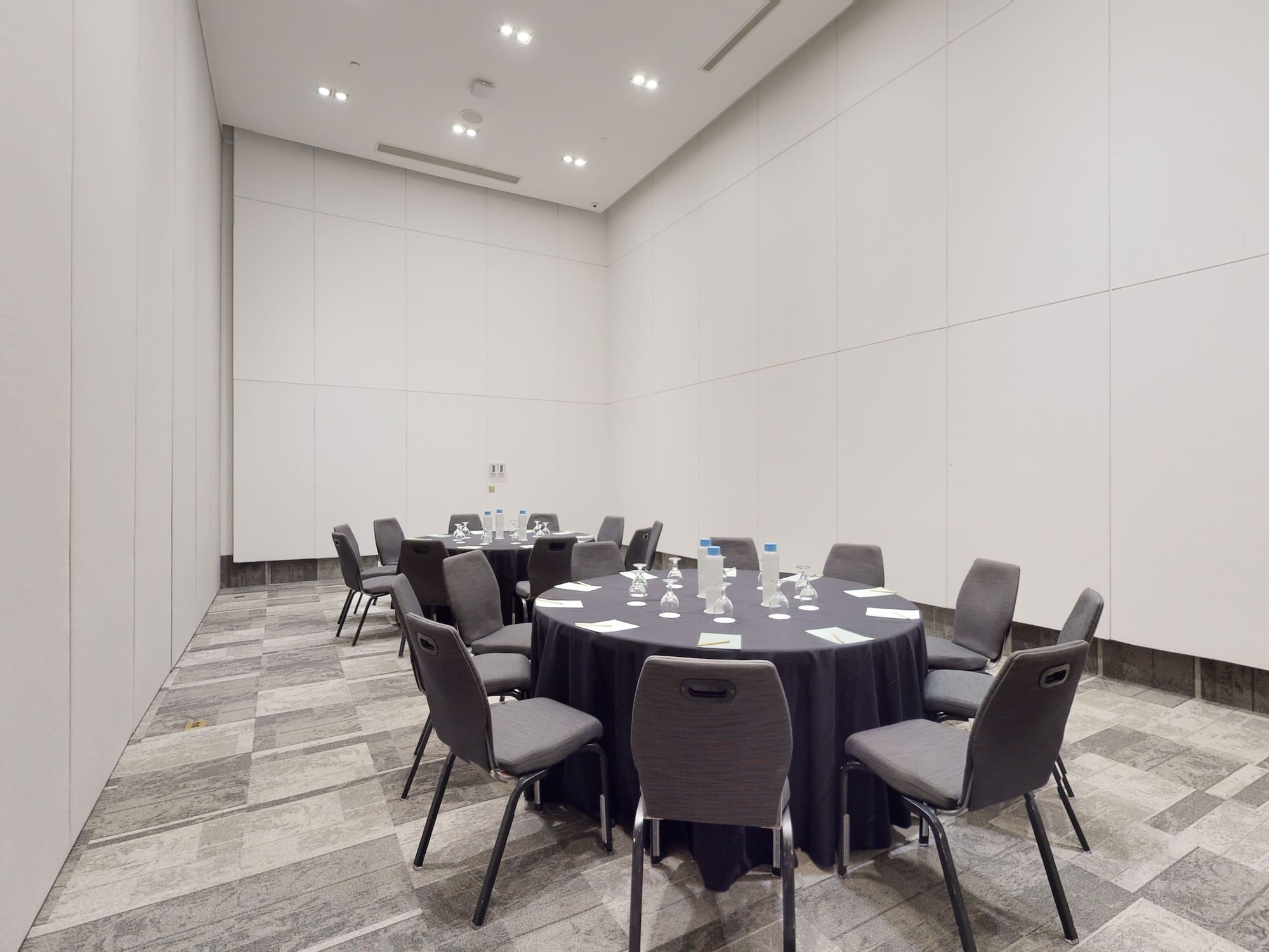 a round table with chairs in a room