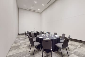 a round table with chairs in a room