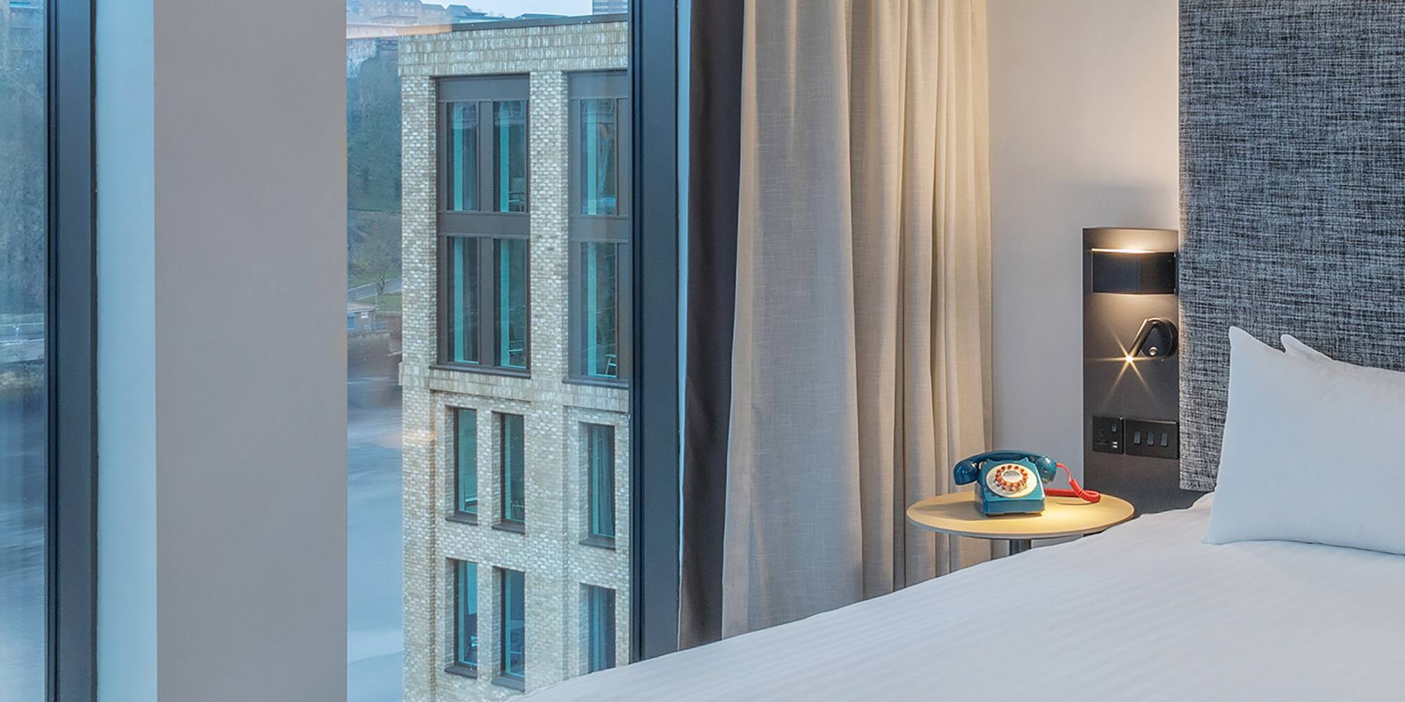 a room with a bed and a window