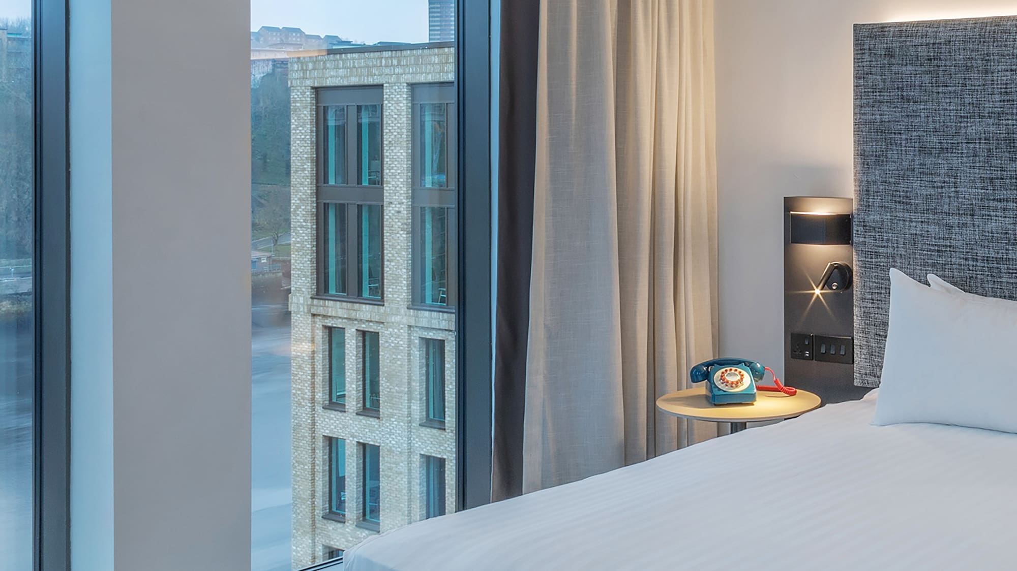 a room with a bed and a window