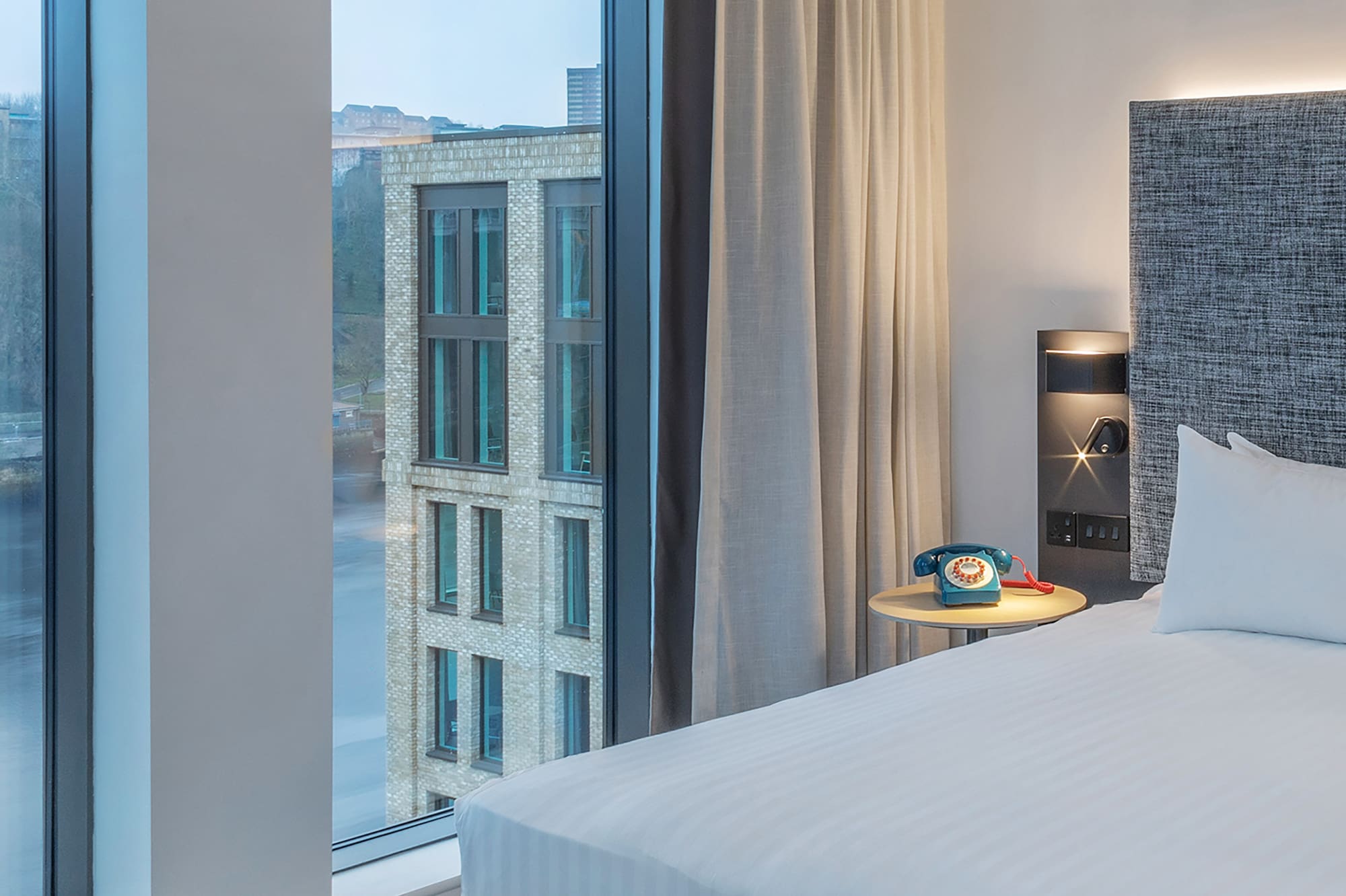 a room with a bed and a window