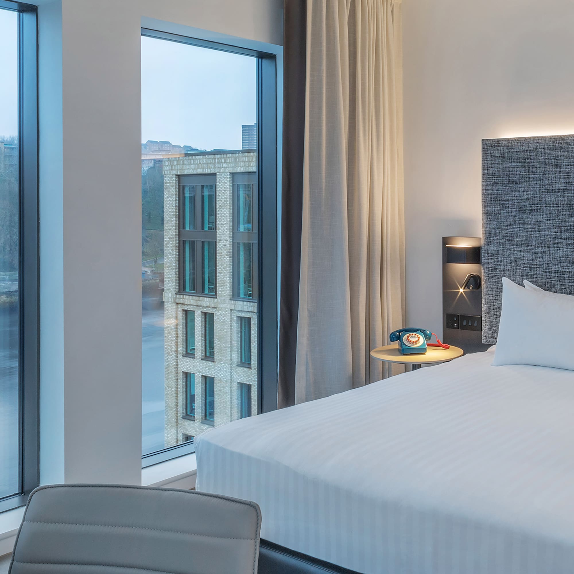 a room with a bed and a window