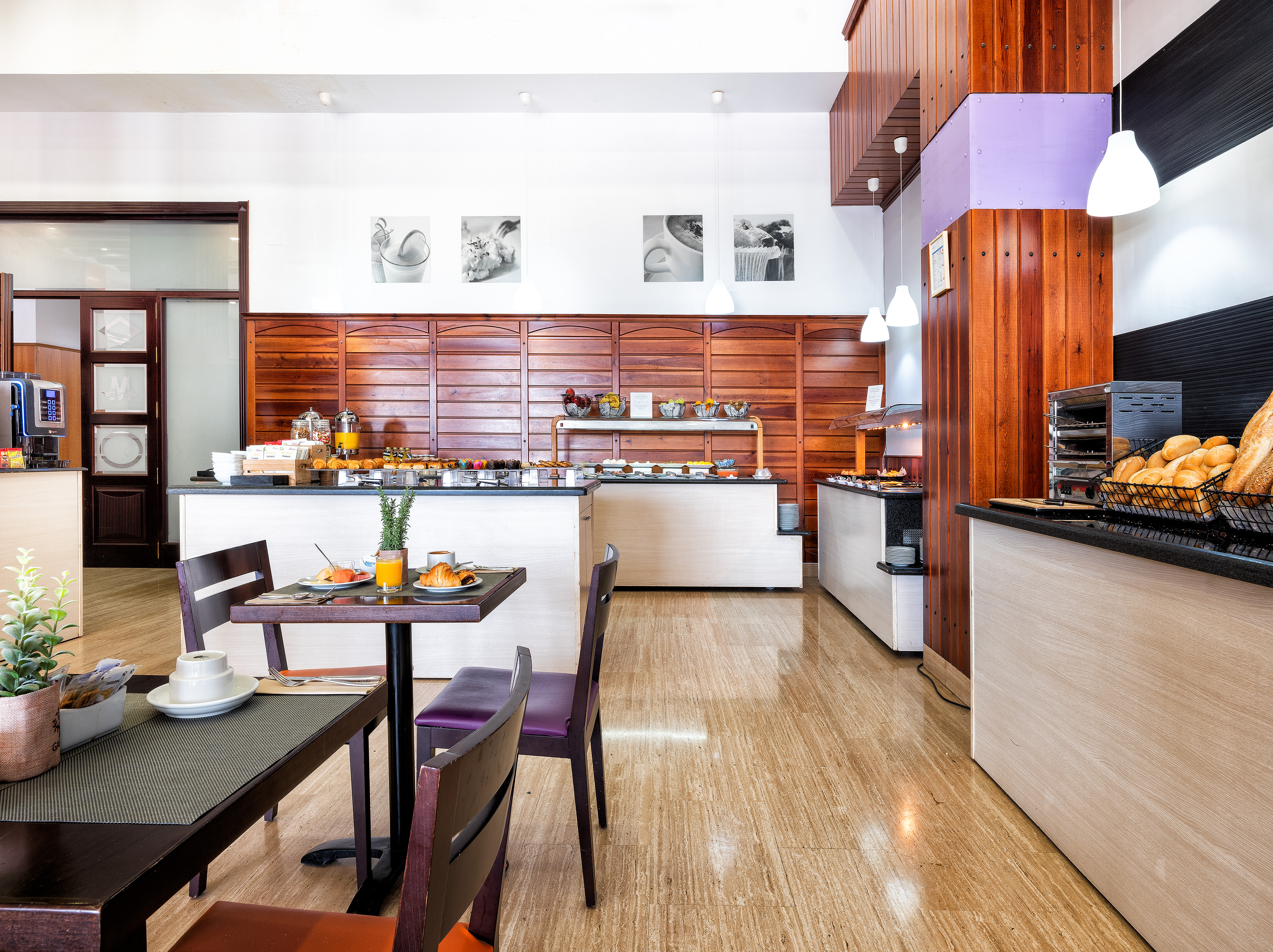 a restaurant with a counter and chairs