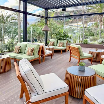 a patio with chairs and tables