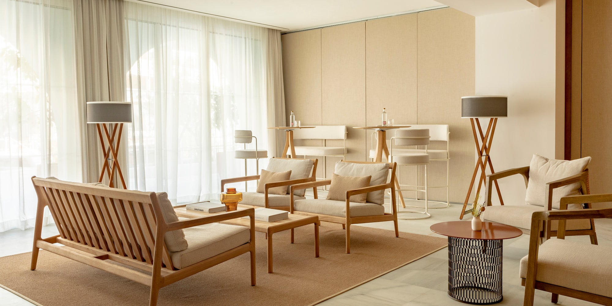 a room with a couch and chairs