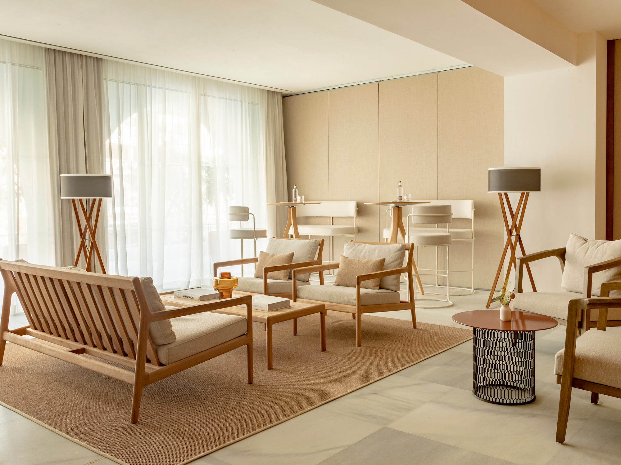 a room with a couch and chairs