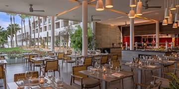 a restaurant with tables and chairs
