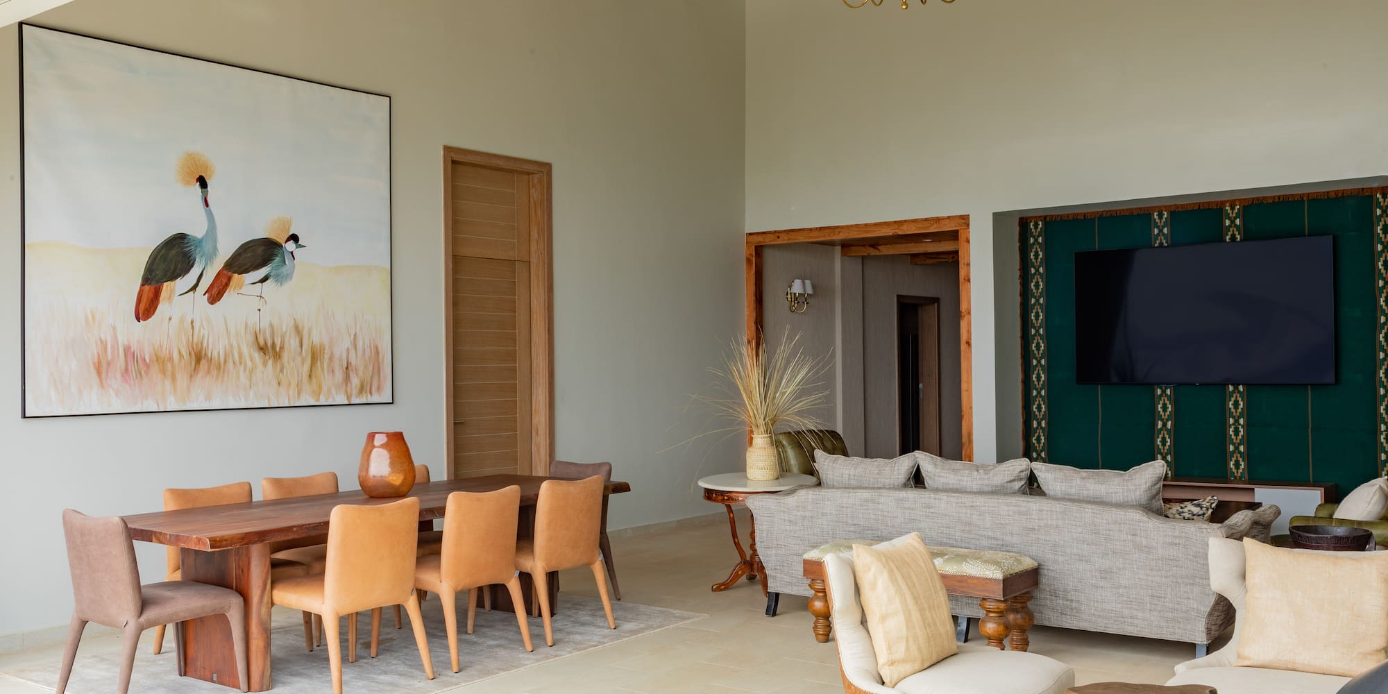 a living room with a couch and chairs