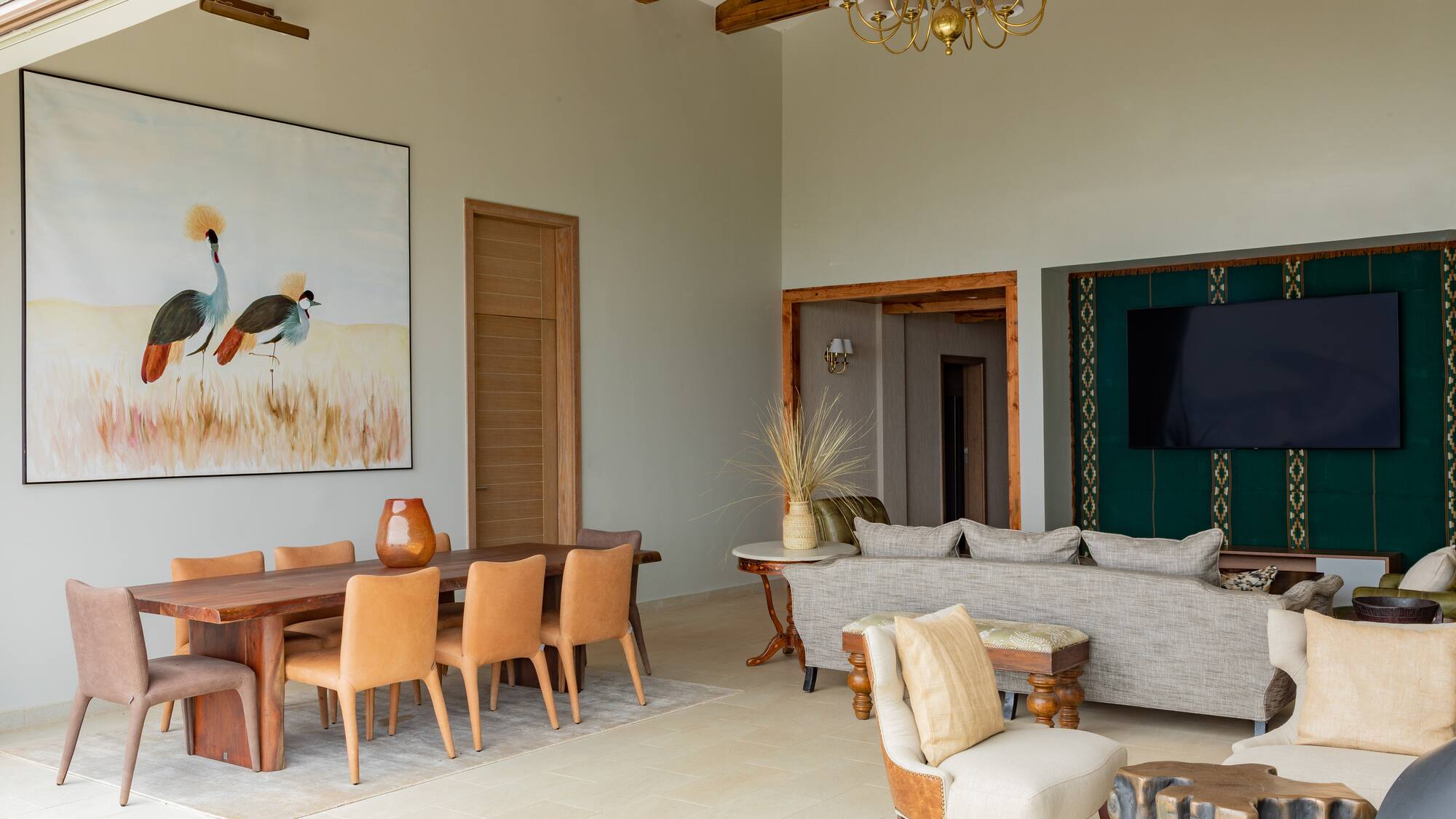 a living room with a couch and chairs