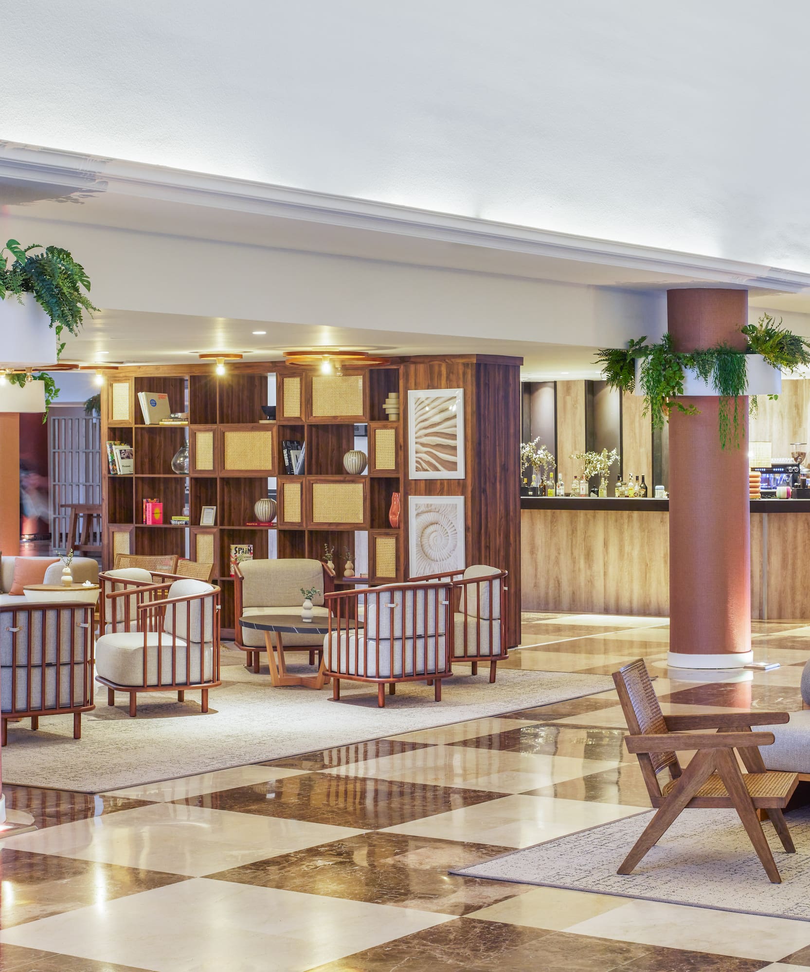 a large room with a checkered floor and a couch and chairs