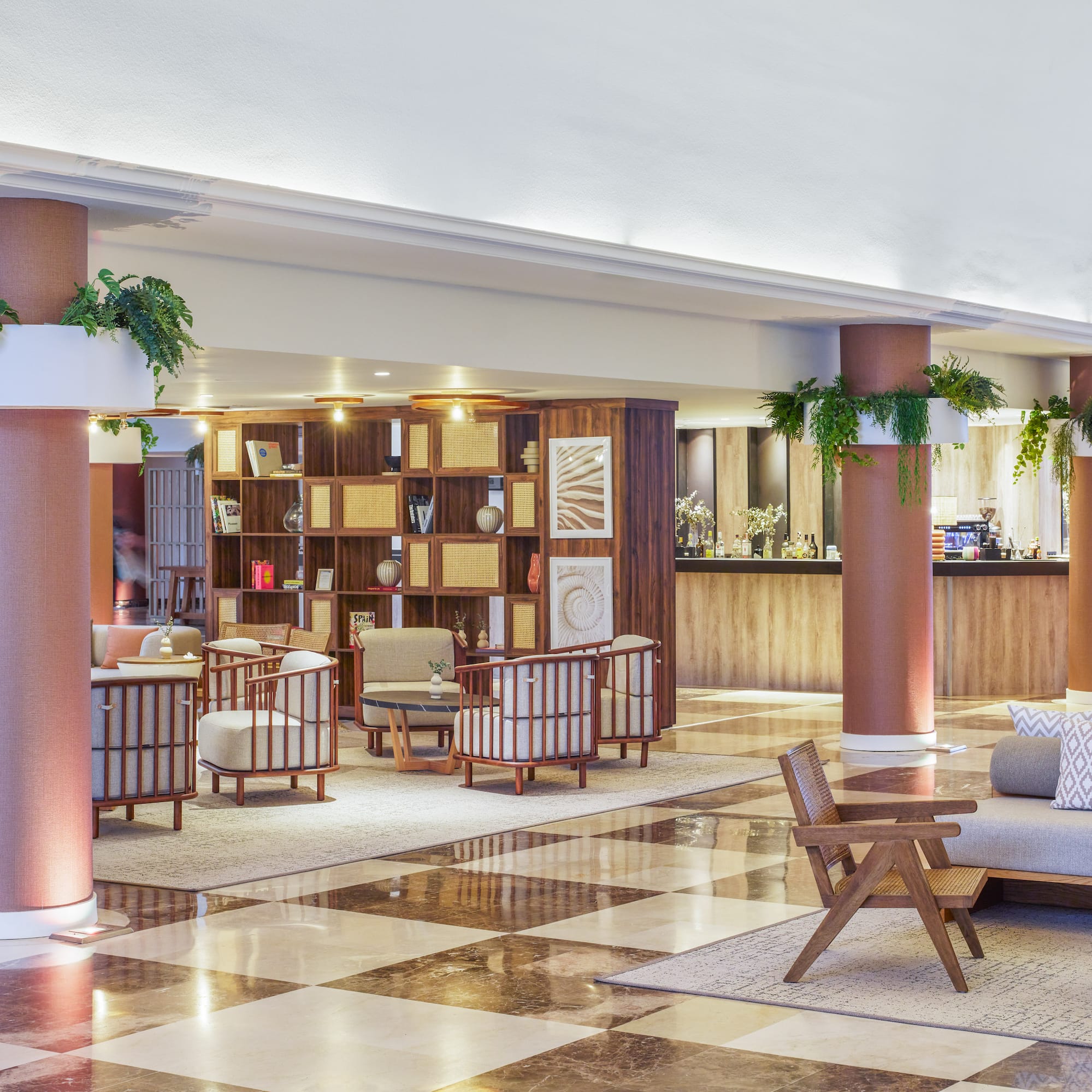 a large room with a checkered floor and a couch and chairs